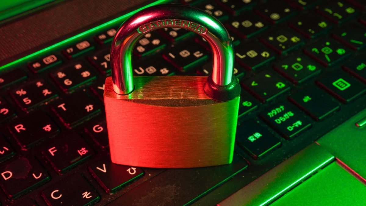 red padlock on black computer keyboard