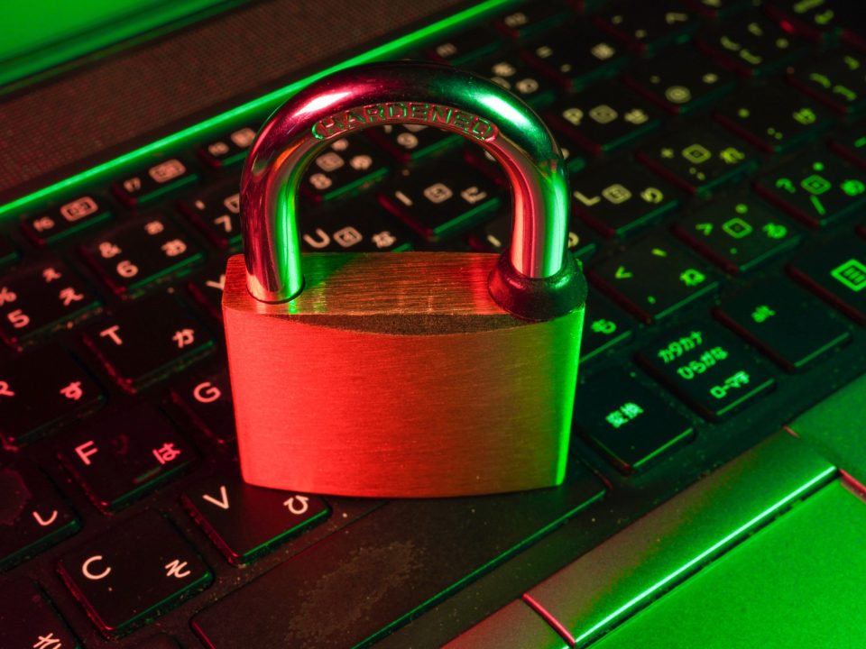 red padlock on black computer keyboard